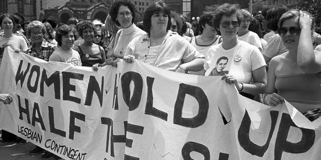 The lesbian contingent at the Back Bay gay pride parade display a banner quoting Mao Zedong: "Women hold up half the sky." Photo Credit Spencer Grant, Spencer Grant Collection at Boston Public Library