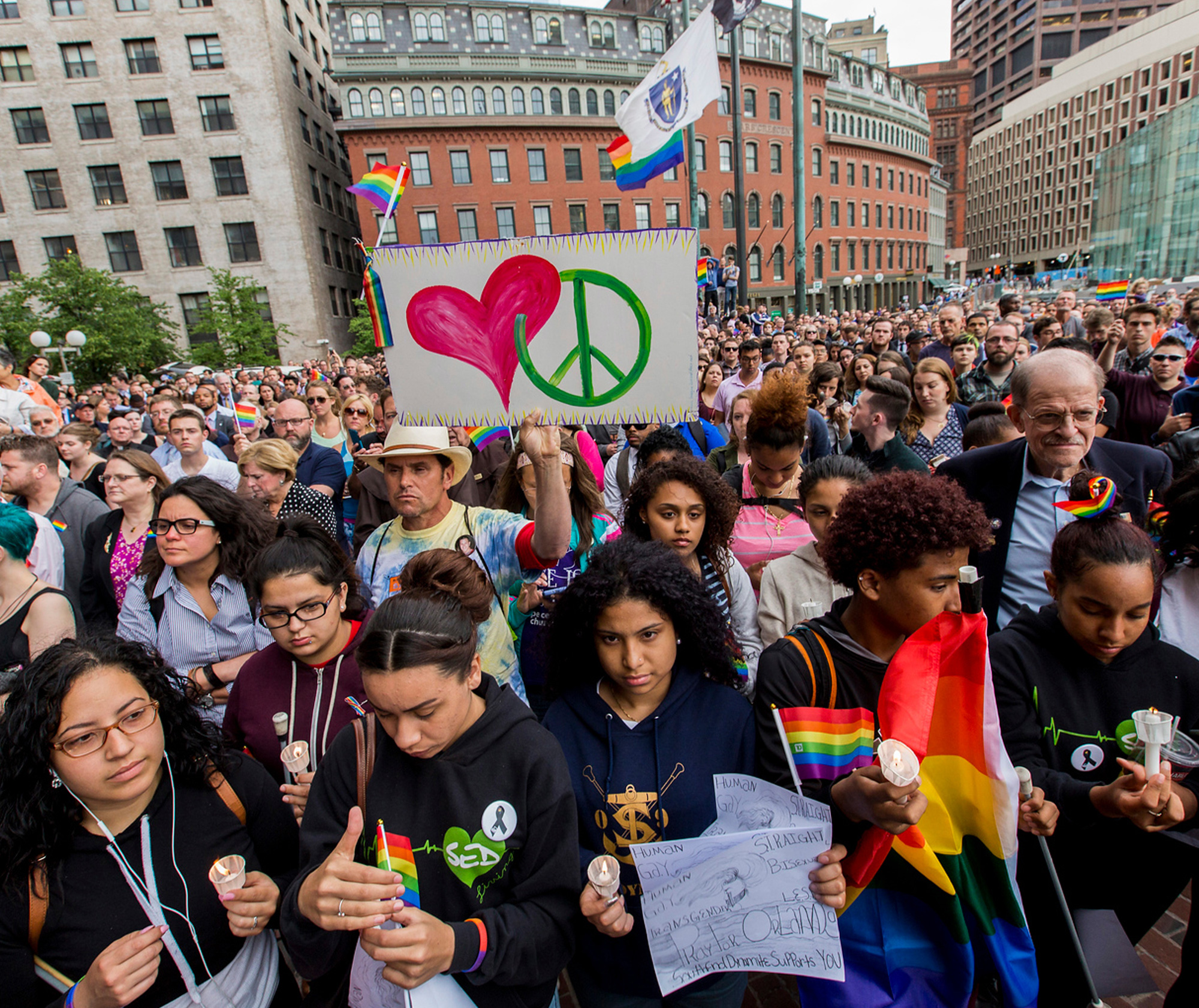 June 13, 2106. Boston. Hundreds of people attended a candlelight vigil for the victims of the Orlando nightclub massacre on City Hall Plaza. Mayor Marty Walsh, Governor Charlie Baker, Massachusetts Attorney General Maura Healey, and other local officials attended the candlelight vigil. Flags are at half-staff at City Hall to honor the 49 people killed at Pulse, a popular gay nightclub. © 2016 Marilyn Humphries