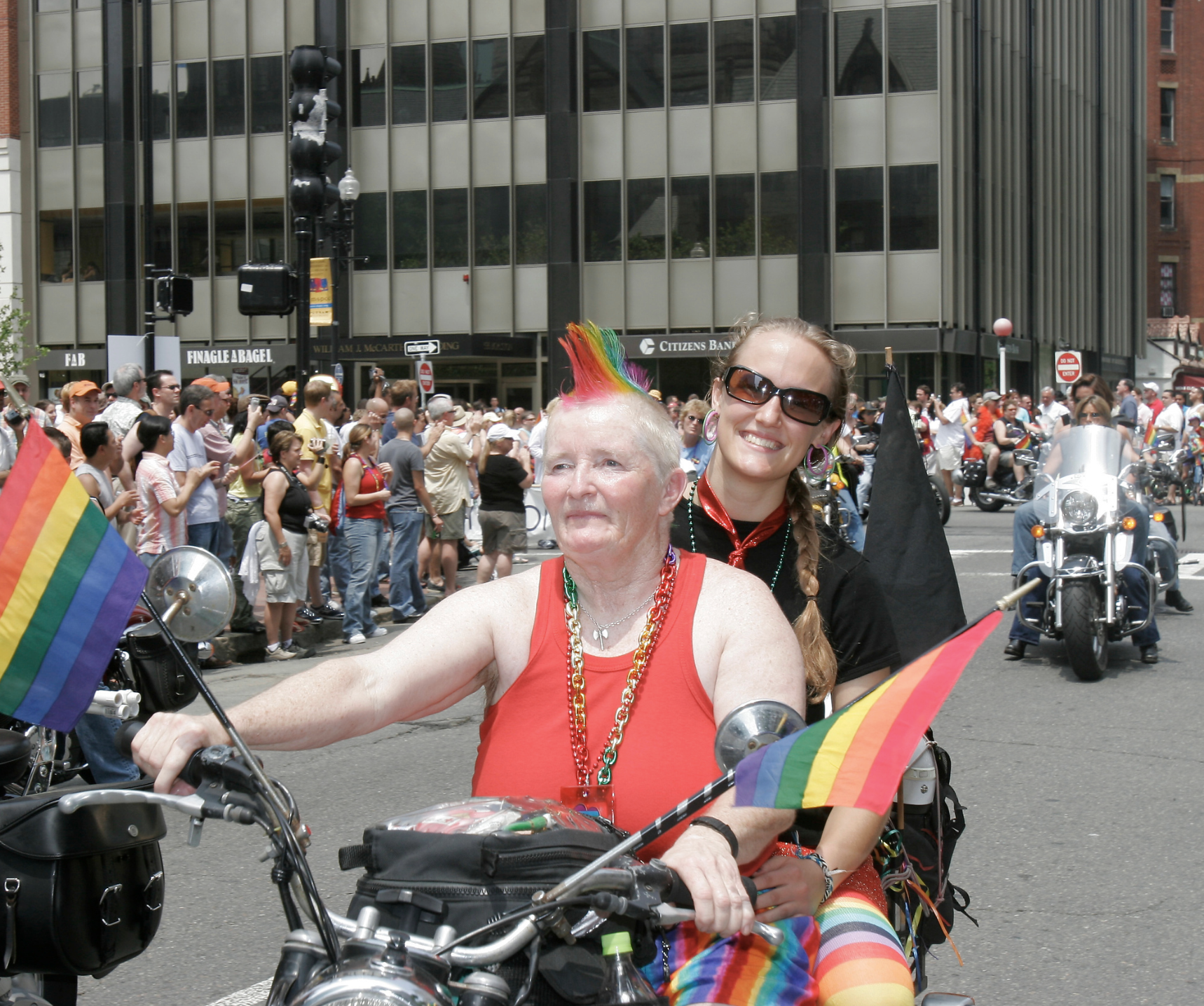Iconic Lesbian Motorcyclist, Woody Woodward riding her motorcycle down Clarendon St during the Boston Pride Parade